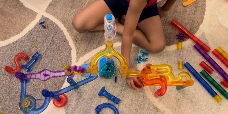 An image of Kids building exciting marble run jumps at home